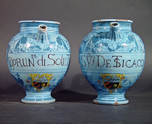 A Pair of Italian Armorial Marchigian Maiolica Berretino-Ground Wet Drug Jars, Early 18th century. SOLD •