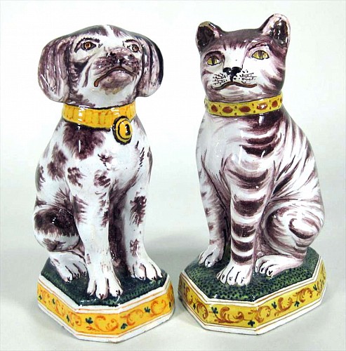 A Pair of Dutch Tin-glazed Earthenware Models of a Dog & Cat,  Tichelaar Brothers, Makkum Holland. Circa 1870-80 SOLD •