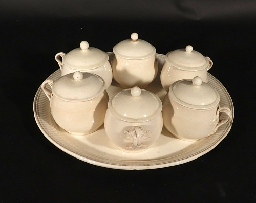 Inventory:  Creamware Pottery, 18th-century Set of English Creamware Pot de Creme and Stand, 1780, $2,250