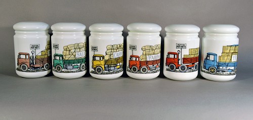 Inventory:  Piero Fornasetti, Piero Fornasetti Opaque White Glass Food Jars and Covers made for Fiat,
Six Jars with Lorry or Truck motif, 1960s, $2,750