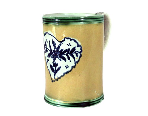 Pearlware Pearlware Mug with Rare Yellow Slip Ground and Heart Decoration, 1780 $1,850