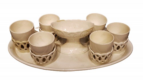 Inventory:  Creamware Pottery, Wedgwood Creamware Egg Cup Stand and Six Egg Cups, 1800-20, $1,950