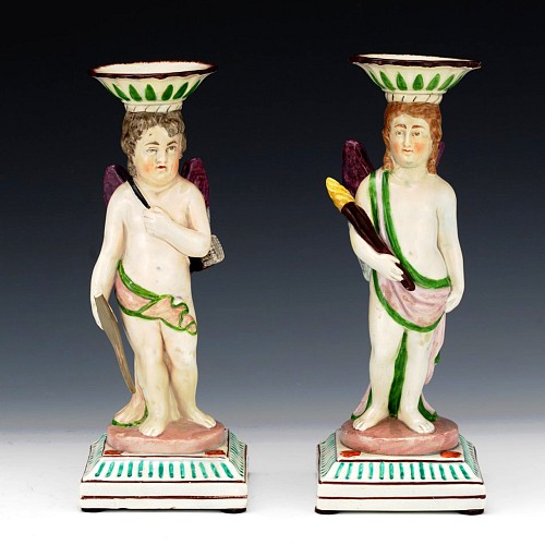 Pearlware English Pearlware Figural Candlesticks of Cupid and a Torchbearer, Attributed to Neale & Co. or Wilson, a Pair, Circa 1800 $2,500